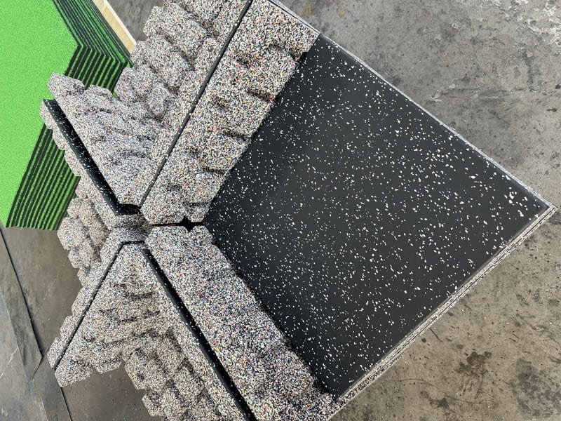 Microscopic view of salt crystals trapped in rubber flooring pores